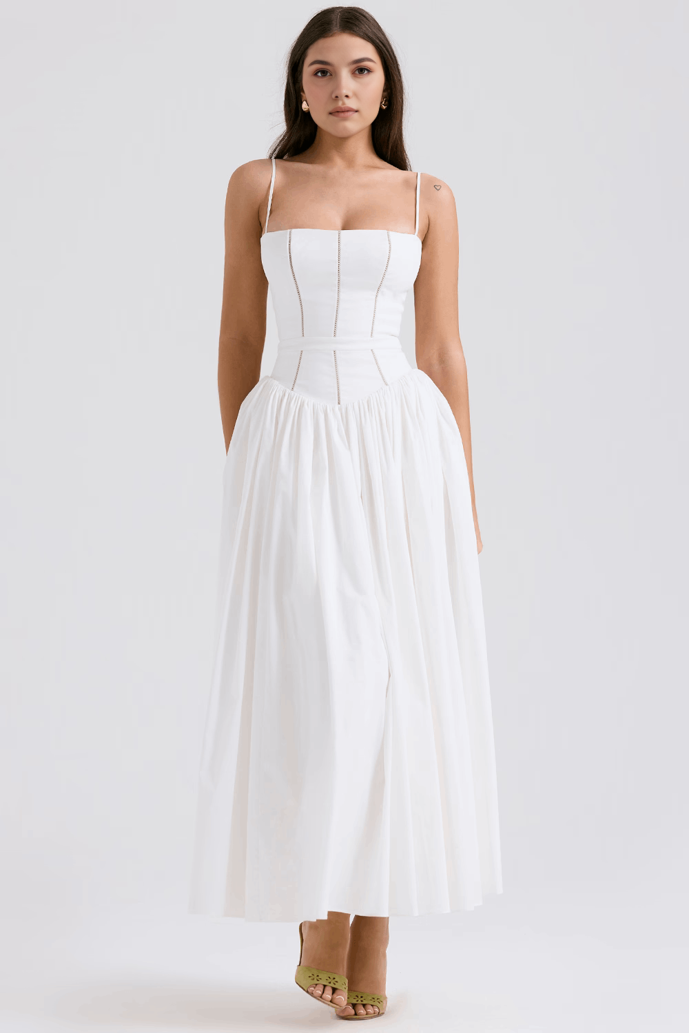 Elegant women's white midi dress featuring a vibrant floral pattern, great for summer parties.