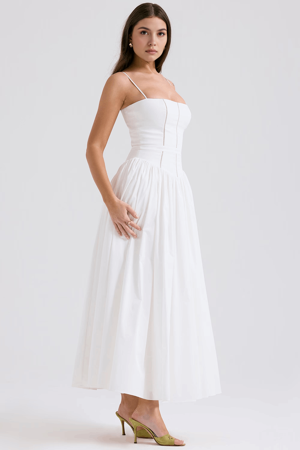 Feminine white floral midi dress for women, an elegant choice for summer garden parties.