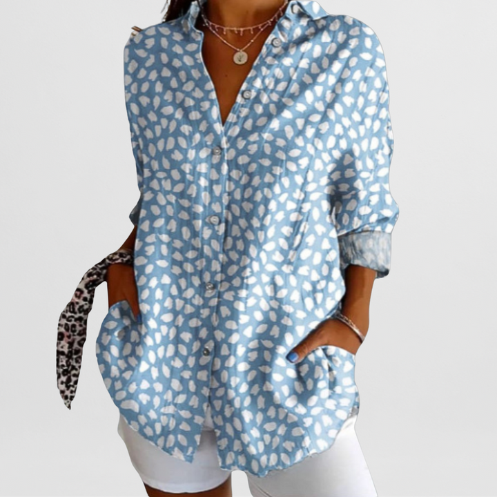 Vibrant ladies' tropical floral loose fit blouse with long sleeves & button front, perfect for casual summer style.