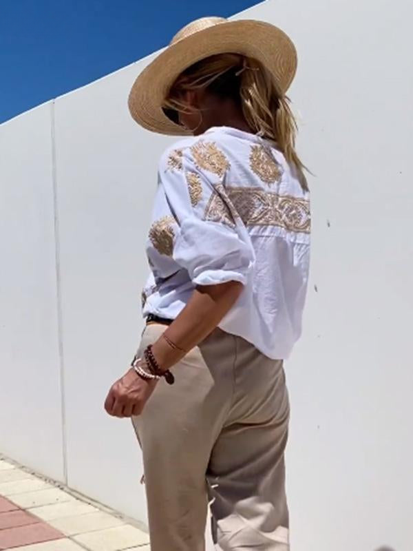 Elegant women's loose-fit boho button-up long sleeve shirt, ideal for versatile everyday and workwear.