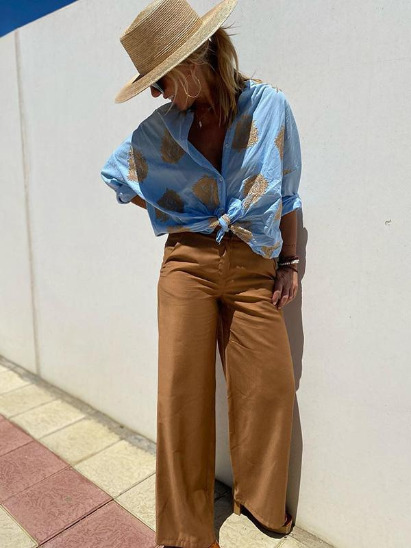 Stylish women's long sleeve boho button-up shirt featuring a relaxed fit for versatile wear.