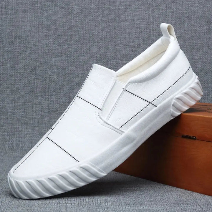 Everyday men's slip-on loafers showcasing a classic casual style and elegant contrast stitching detail.