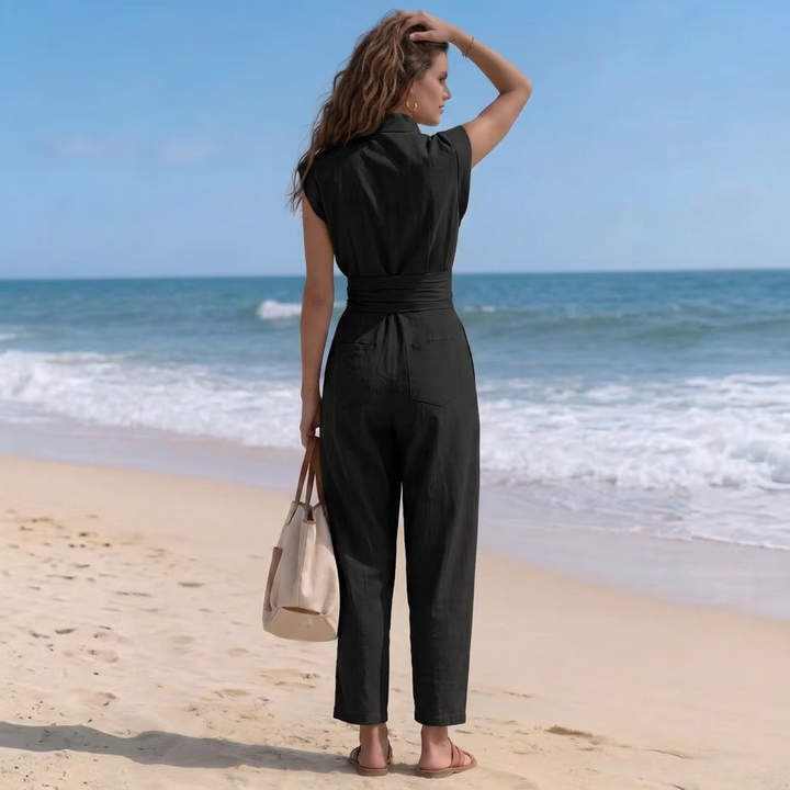Modern women's harem jumpsuit with a sophisticated high neck and flattering ruched waist. Ideal for casual elegance.