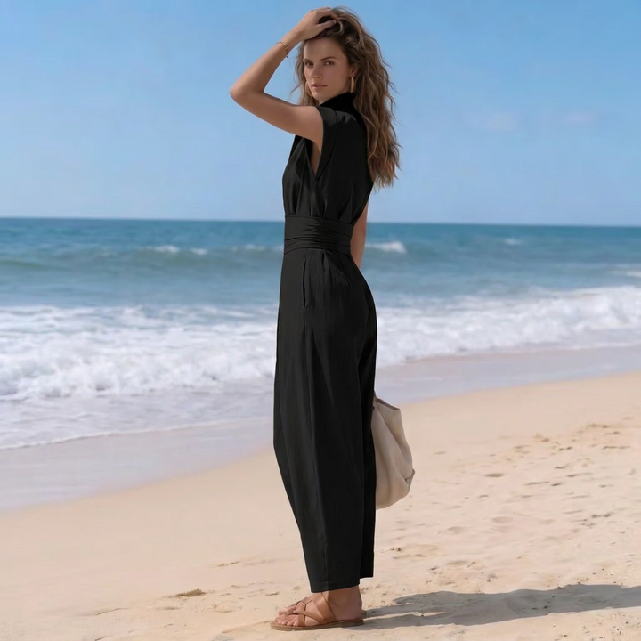 Chic & comfortable women's harem jumpsuit with high neck & cap sleeves. Ruched waist for a flattering modern look.