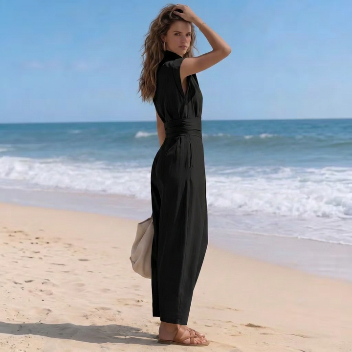 Elegant women's jumpsuit featuring a high neck, cap sleeves, and stylish ruched waist. Versatile all-day wear.