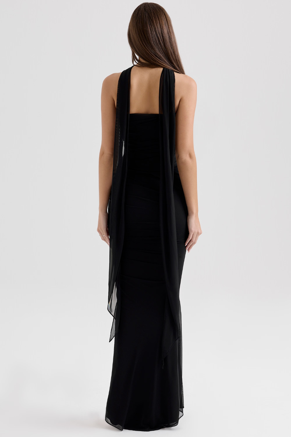 Sheer mesh overlay on an elegant women's corset midi dress, ideal for special occasions.