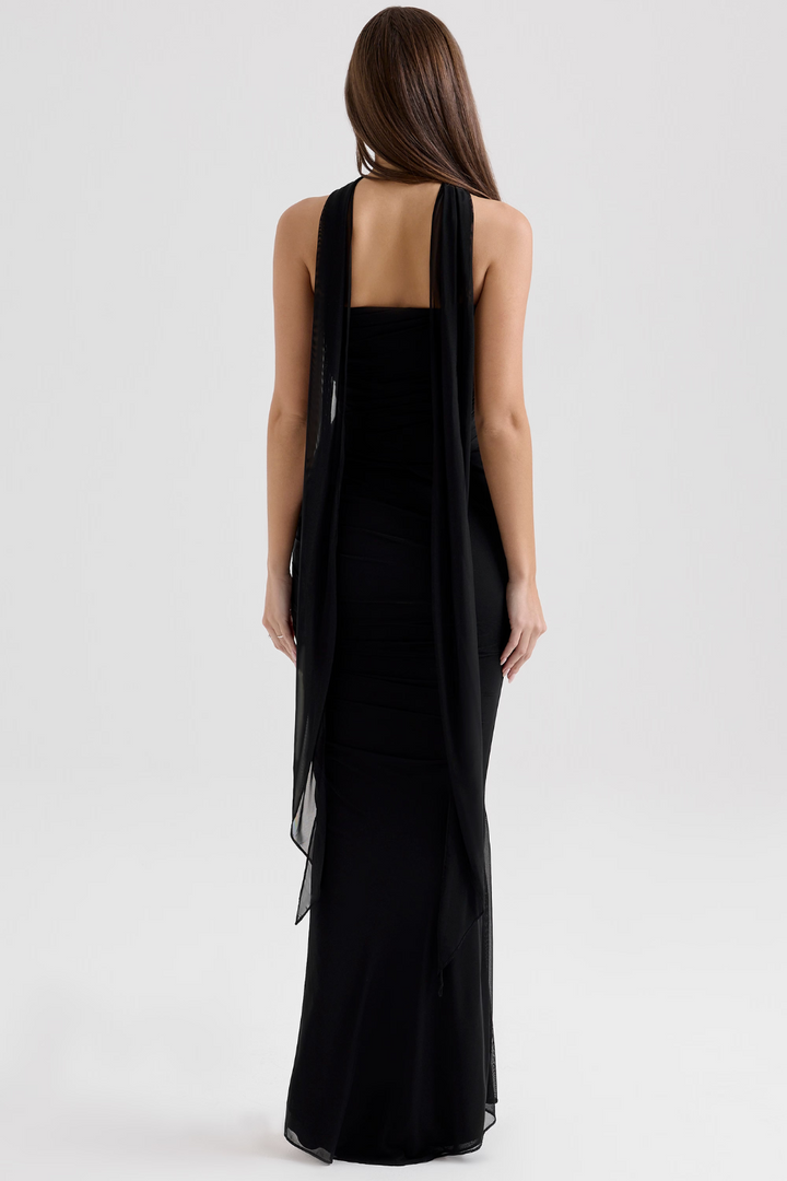 Sheer mesh overlay on an elegant women's corset midi dress, ideal for special occasions.