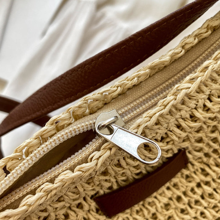 Model wearing a women's spacious bohemian shoulder bag, ideal for daily use and stylish accessory.
