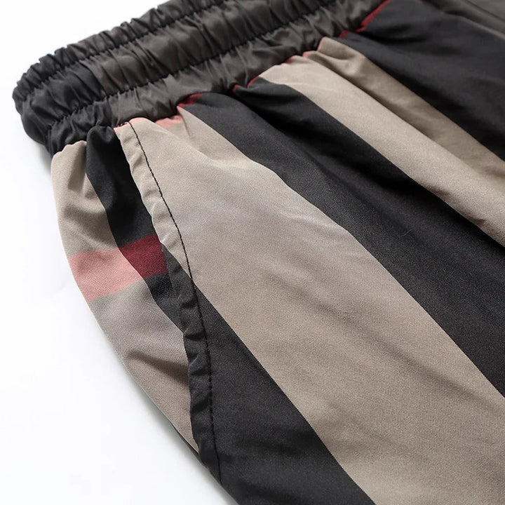 Brown/khaki men's everyday comfort shorts with a relaxed fit. Versatile and stylish designer bottoms.