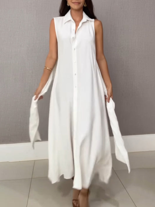 Graceful sleeveless midi dress with tie waist, offering a flattering and luxurious feel.