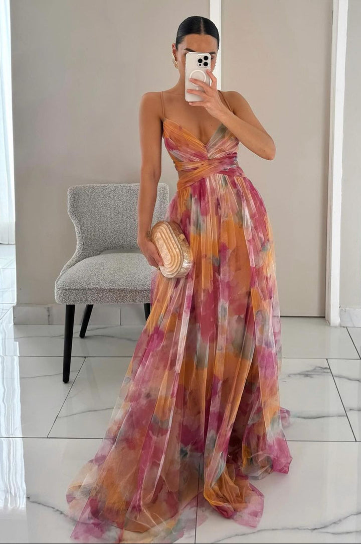 Women's floral maxi evening dress with a flowy silhouette, perfect for elegant summer parties & occasions.