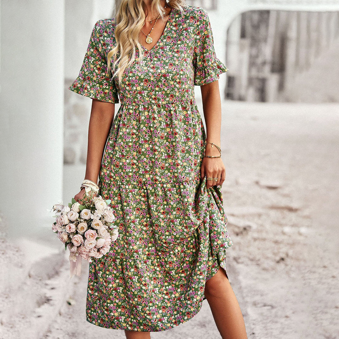 Beautiful women's floral summer midi dress with short sleeves, blending elegance with casual style.