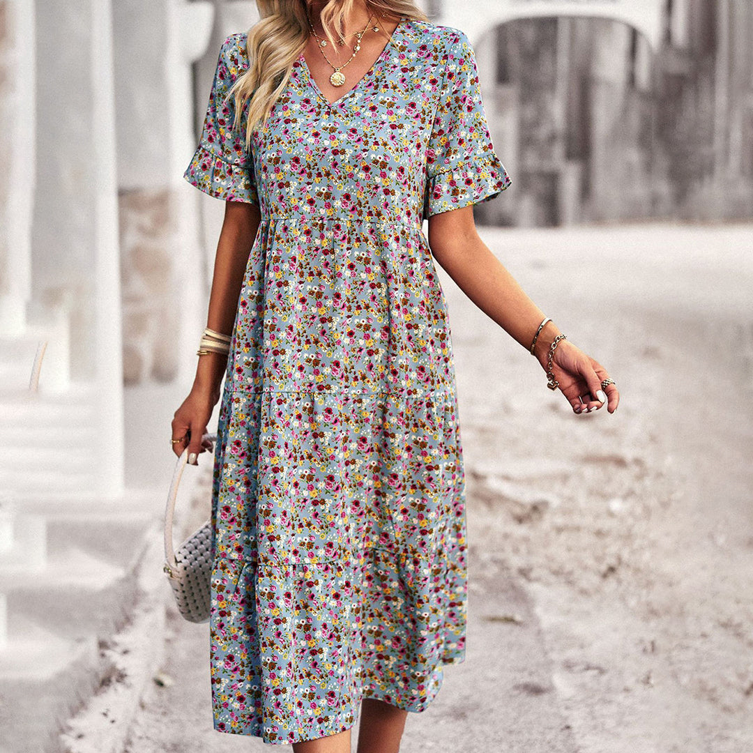 Versatile women's short sleeve floral midi dress, suitable for elegant summer fashion or casual wear.