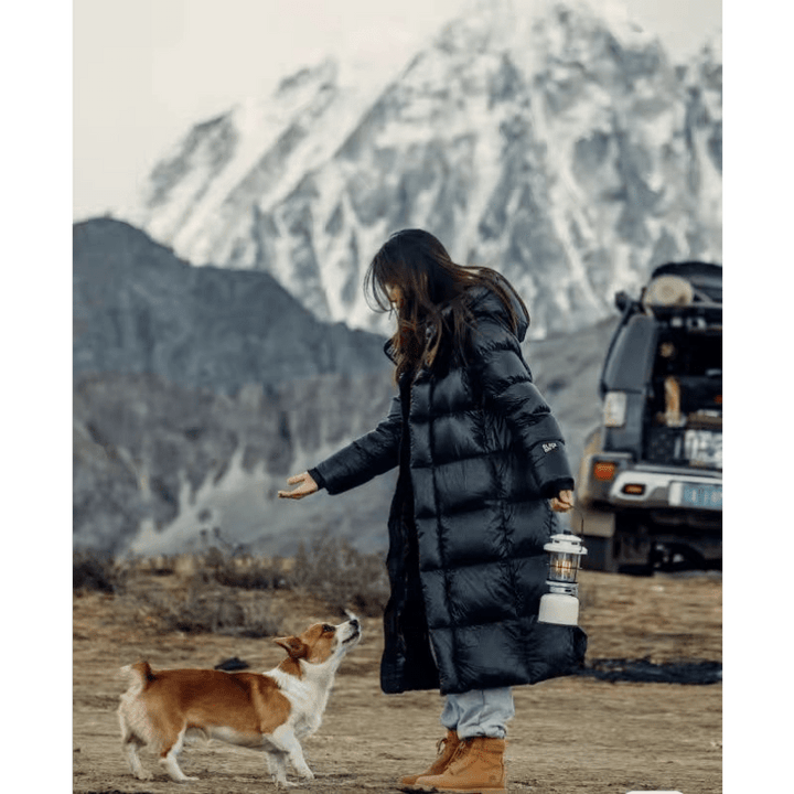 Stylish women's longline quilted winter coat for sophisticated warmth.