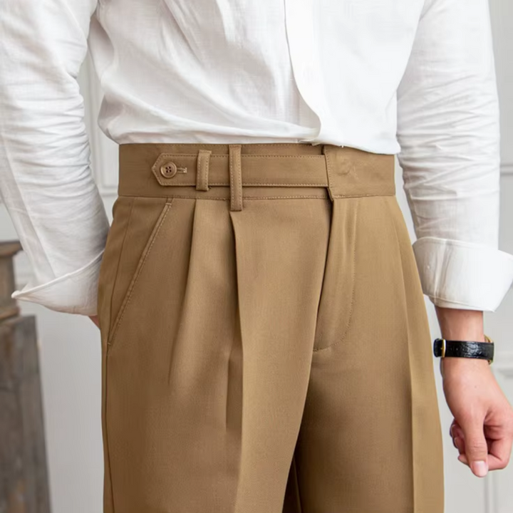 Comfortable beige pleated chino trousers, ideal for all-day wear with style.
