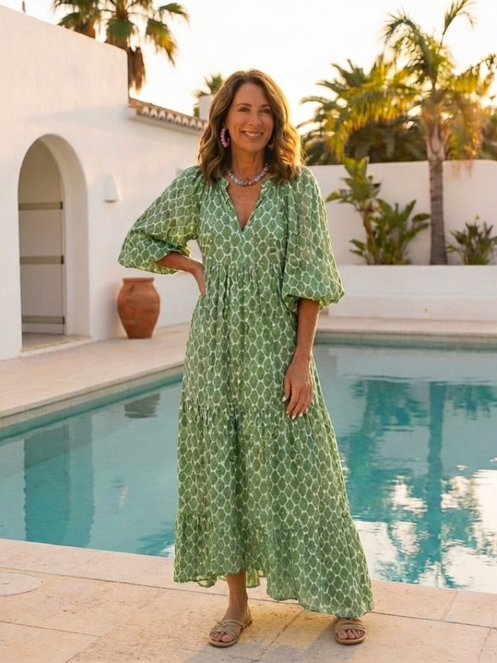 Versatile patterned midi dress for women. Elegant V-neck, 3/4 sleeves, and a flowy silhouette for any occasion.