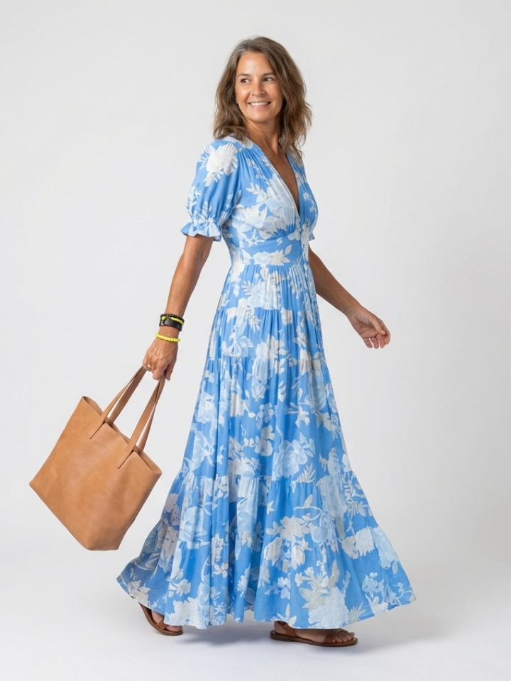 Chic women's V-neck floral midi dress. Short-sleeved, gathered waist design offers elegant, comfortable style.