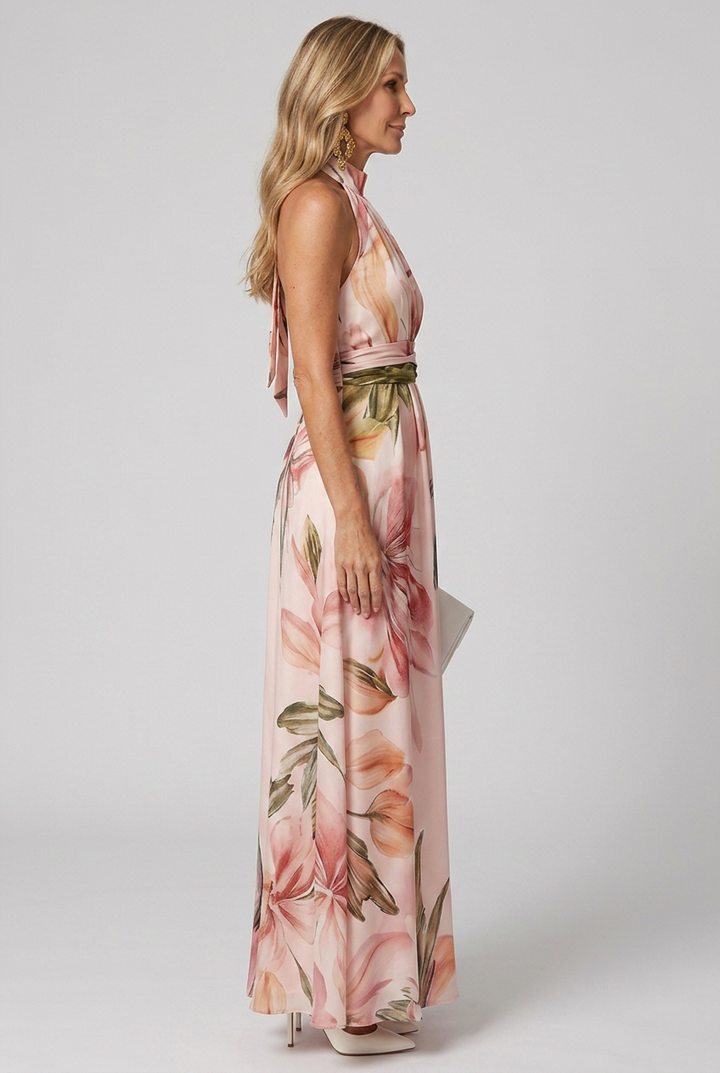 Boho-chic women's floral halter maxi dress. Elegant, flowing sleeveless summer style, ideal for beach & parties.