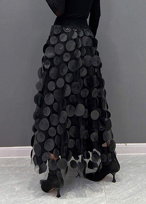Side view of women's elegant polka dot patchwork long skirt, flowing design for versatile wear.