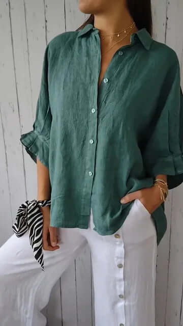 Women's casual long-sleeve shirt featuring a chic loop closure. Relaxed fit for comfortable spring/summer style.