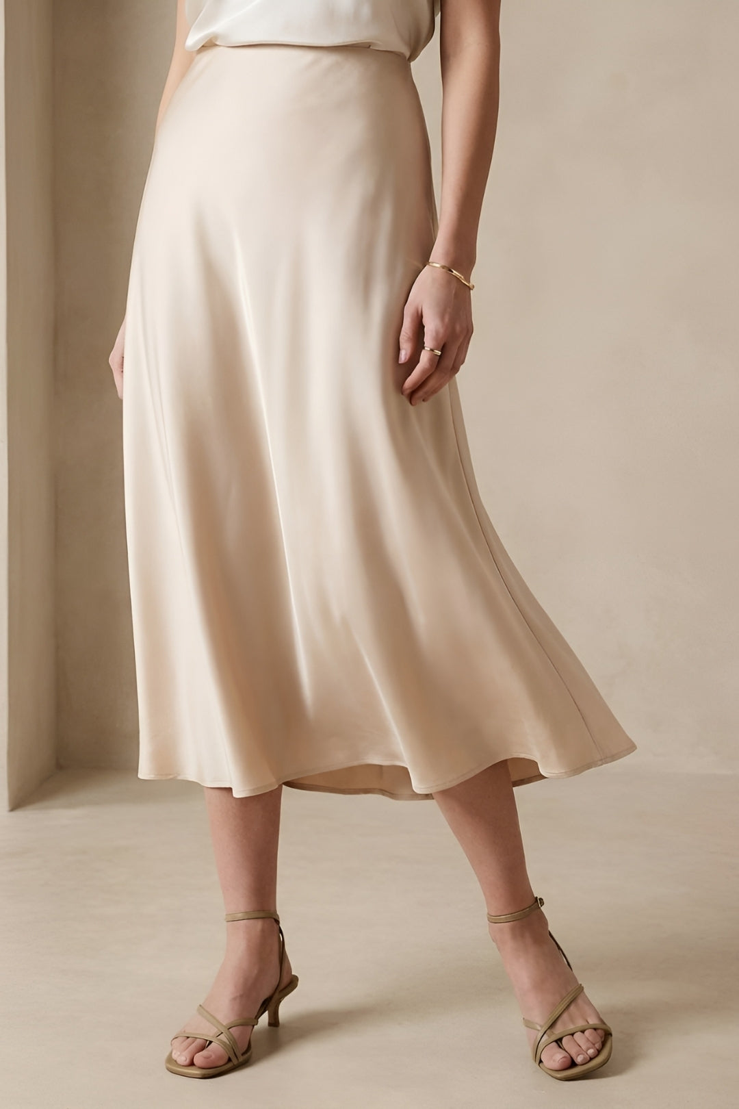 Elegant women's A-line midi skirt with a high waist. Versatile for office, smart casual, or minimalist everyday wear.