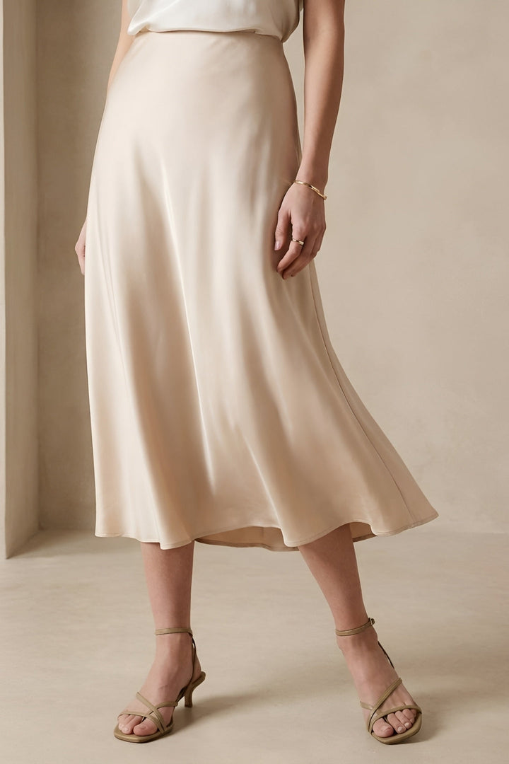 Elegant women's A-line midi skirt with a high waist. Versatile for office, smart casual, or minimalist everyday wear.