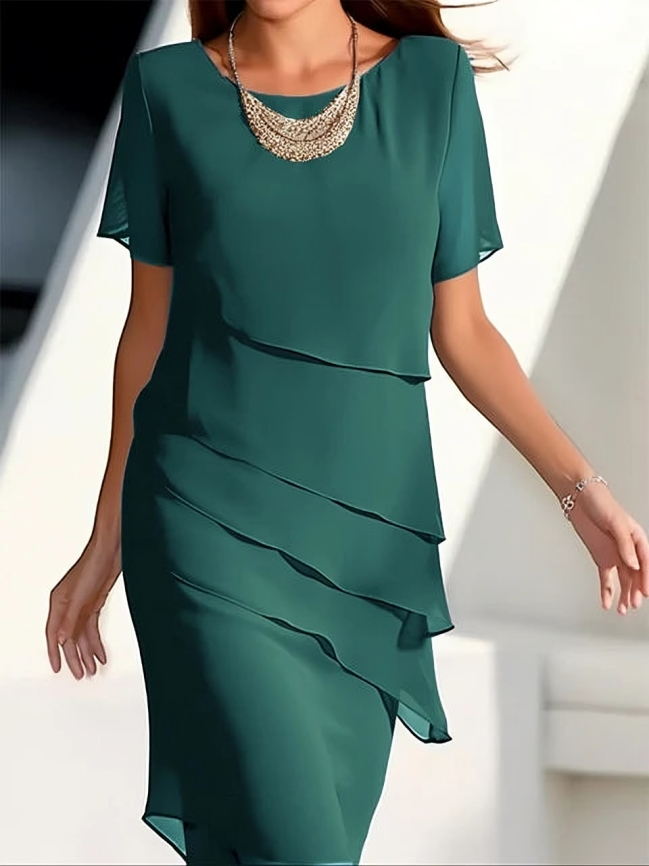 Chic women's layered midi dress. Features short sleeves & an elegant design, perfect for evening or occasion wear.
