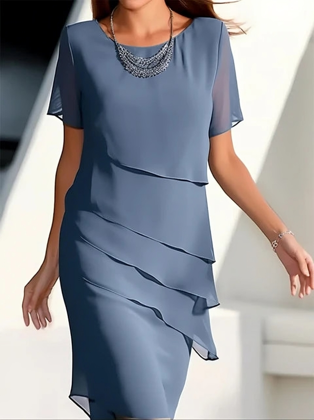 Sophisticated short-sleeve women's midi dress. Features elegant layering, ideal for occasion wear & fashion.