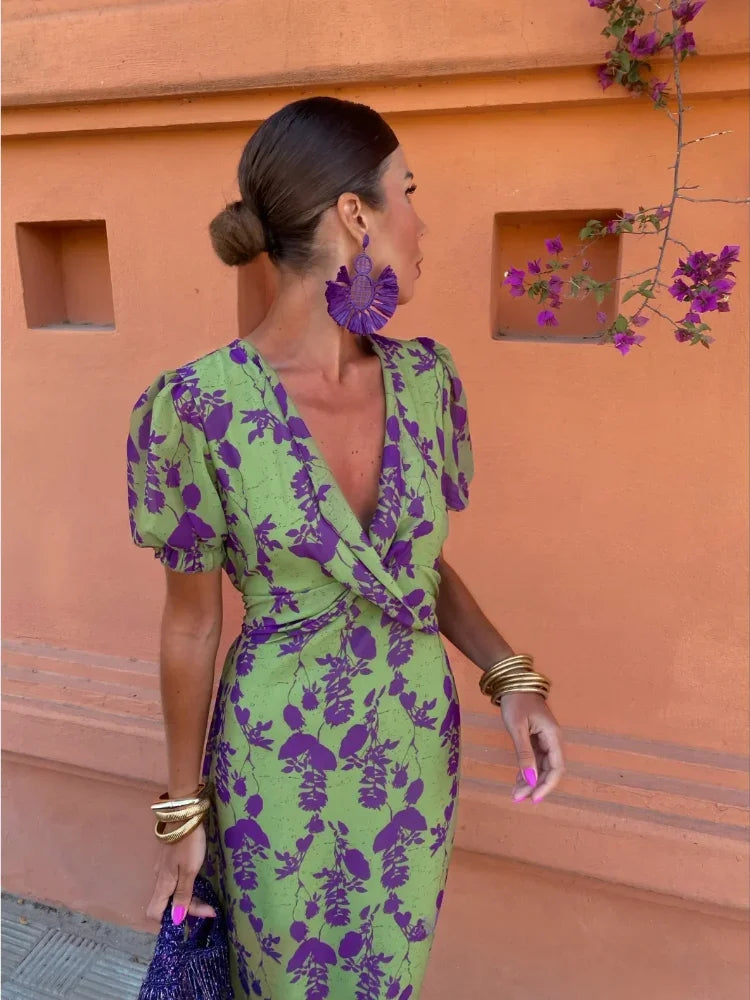 Elegant green floral maxi dress for women, featuring a flattering wrap V-neck and short sleeves. Perfect for spring/summer.