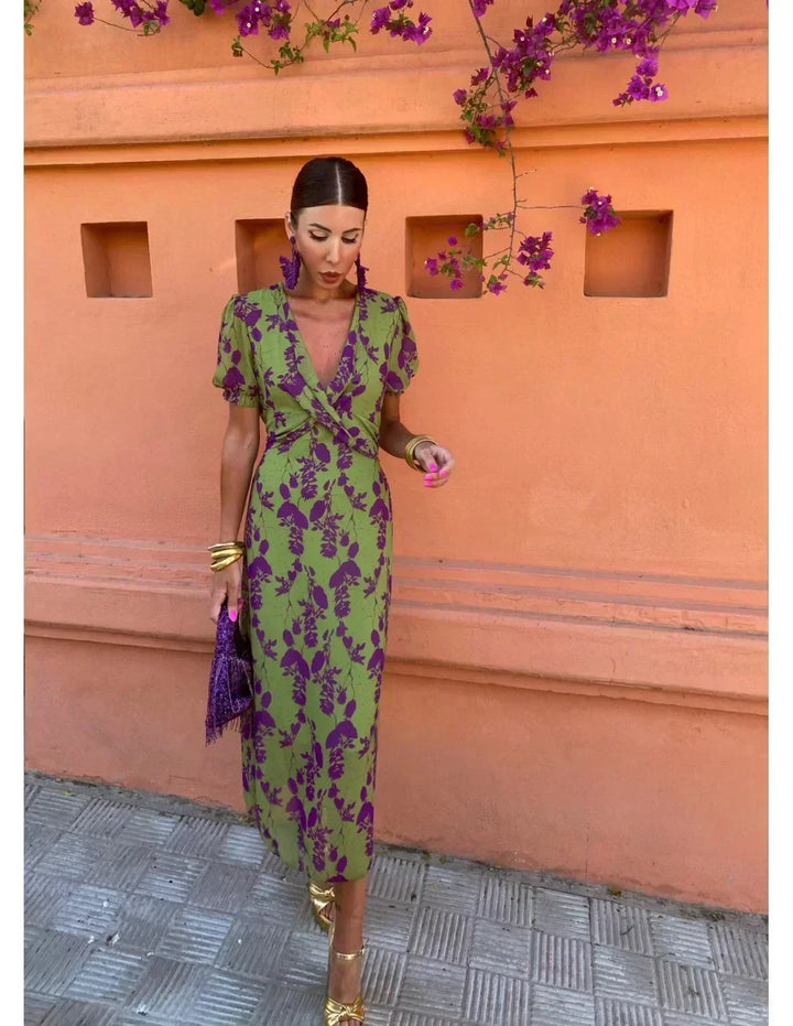 Green floral women's maxi dress with a sophisticated wrap V-neck. A versatile short sleeve dress for casual or elegant wear.