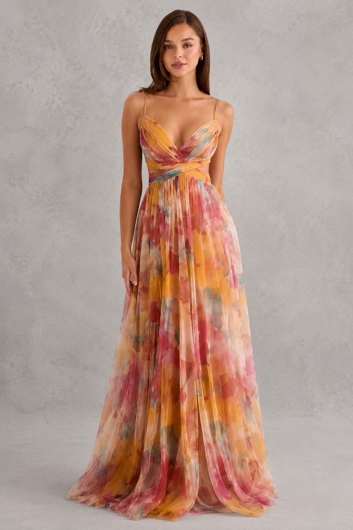 Woman in elegant flowy wrap maxi dress, perfect for summer style & vacation fashion.