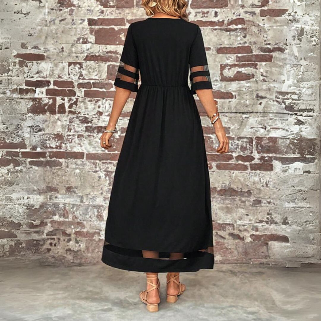 Detail of elegant women's maxi dress showcasing the flattering, comfortable fit & chic design.