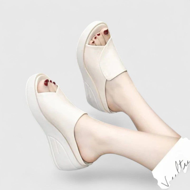 Stylish women's comfort wedge sandals with shock-absorbing arch support. Perfect casual summer footwear for everyday relief.
