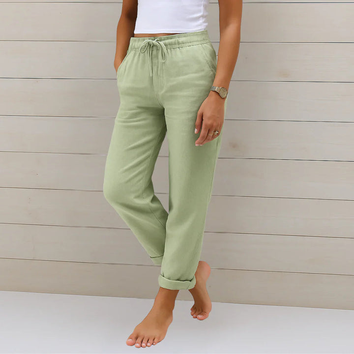Close-up of breathable fabric on women's elegant stretch trousers, highlighting comfort.