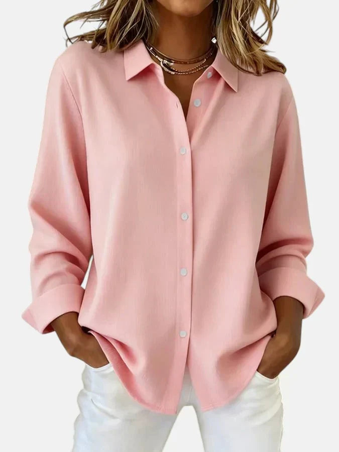 White women's button collar blouse. Classic elegant design, versatile for work or casual fashion. Comfortable.