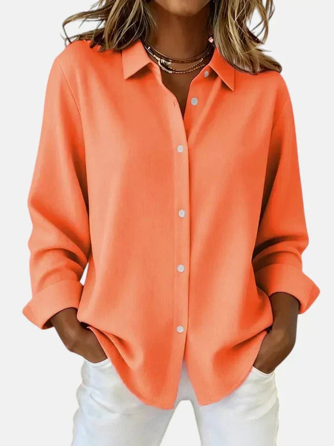 Red women's versatile button collar blouse. Elegant, comfortable style for fashion-forward looks.