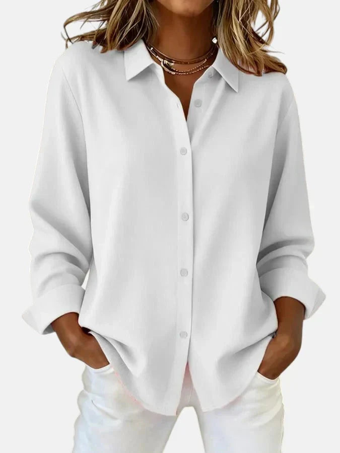 Blue elegant button collar blouse for women. Comfortable, versatile style for effortless daily fashion.
