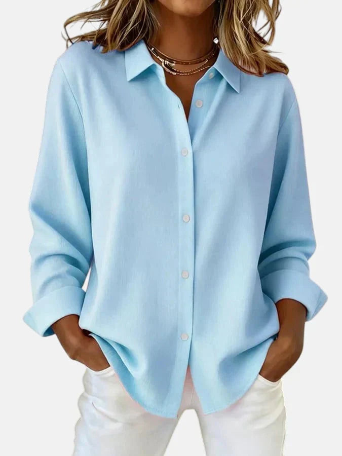 Orange women's elegant button collar blouse. Chic, comfortable & versatile for stylish fashion outfits.
