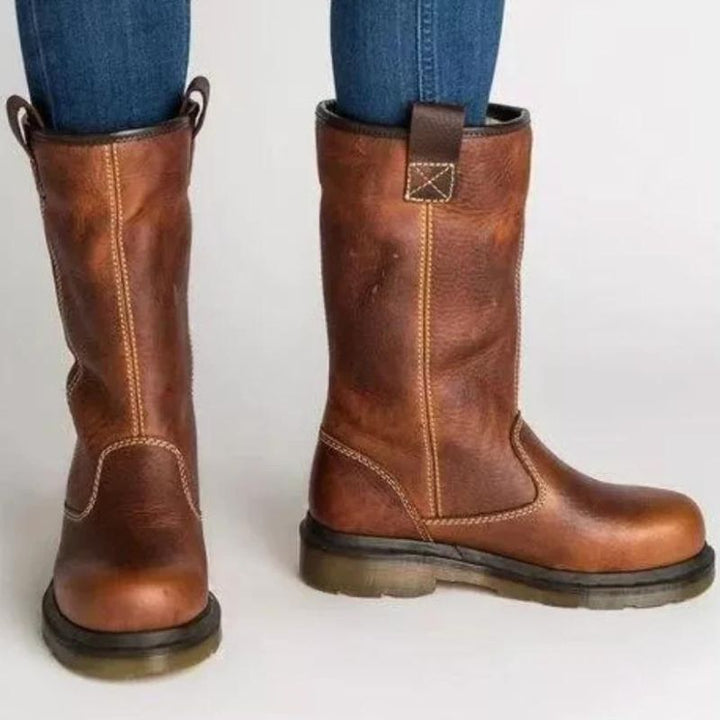 Rugged men's ankle boots: brown pull-on style with warm faux shearling for ultimate winter comfort and everyday wear.