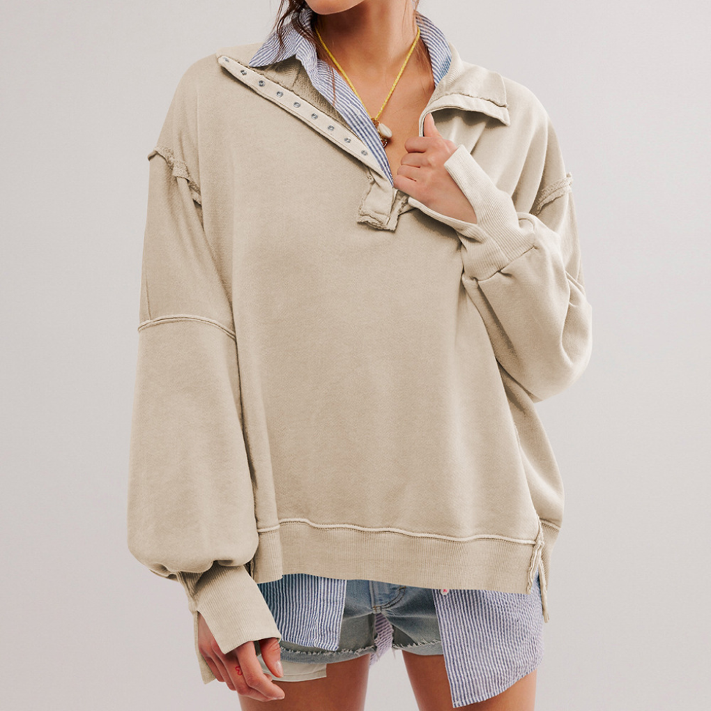 Long sleeve women's Henley pullover with a relaxed fit. Ideal for comfortable, casual everyday style.