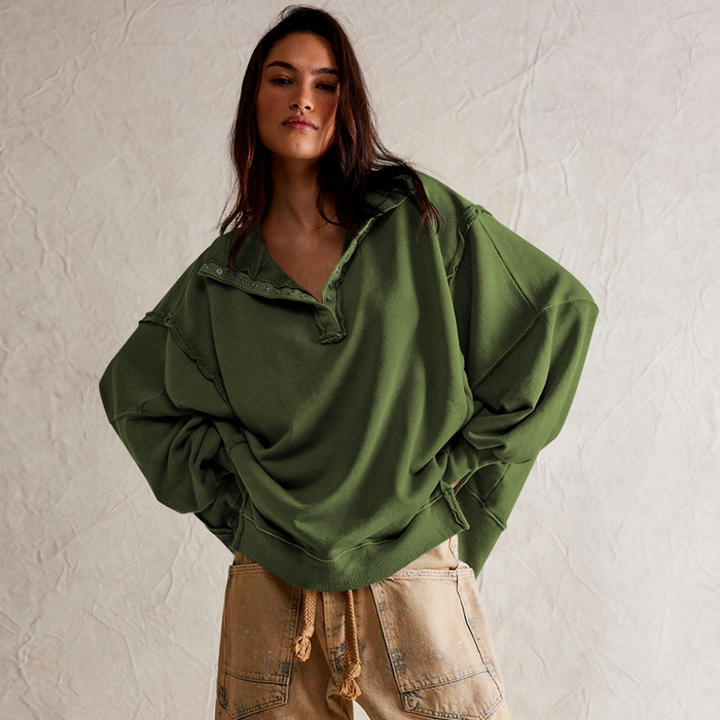 Oversized women's Henley pullover, relaxed fit. A versatile long-sleeve top for casual and comfortable wear.