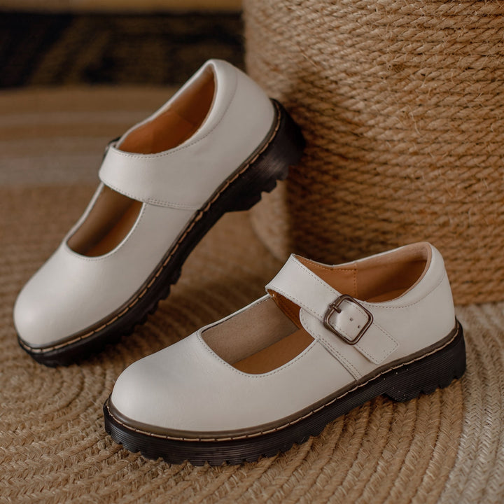 Classic women's two-tone Mary Jane shoes, featuring a comfortable block heel & elegant design with an adjustable strap.