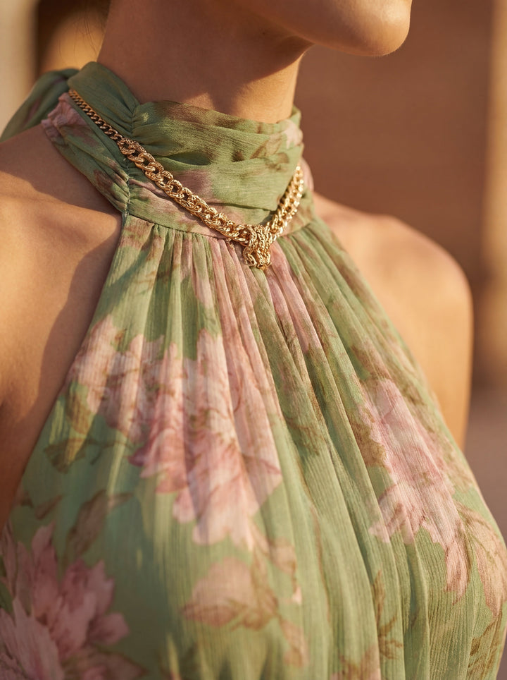 Beautiful women's floral halter neck midi dress, an elegant choice for summer parties and chic occasions.