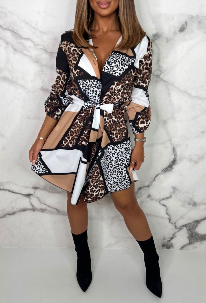 Chic women's animal print mini shirt dress. Long-sleeve, versatile day dress in trendy leopard print. Flirty fashion.
