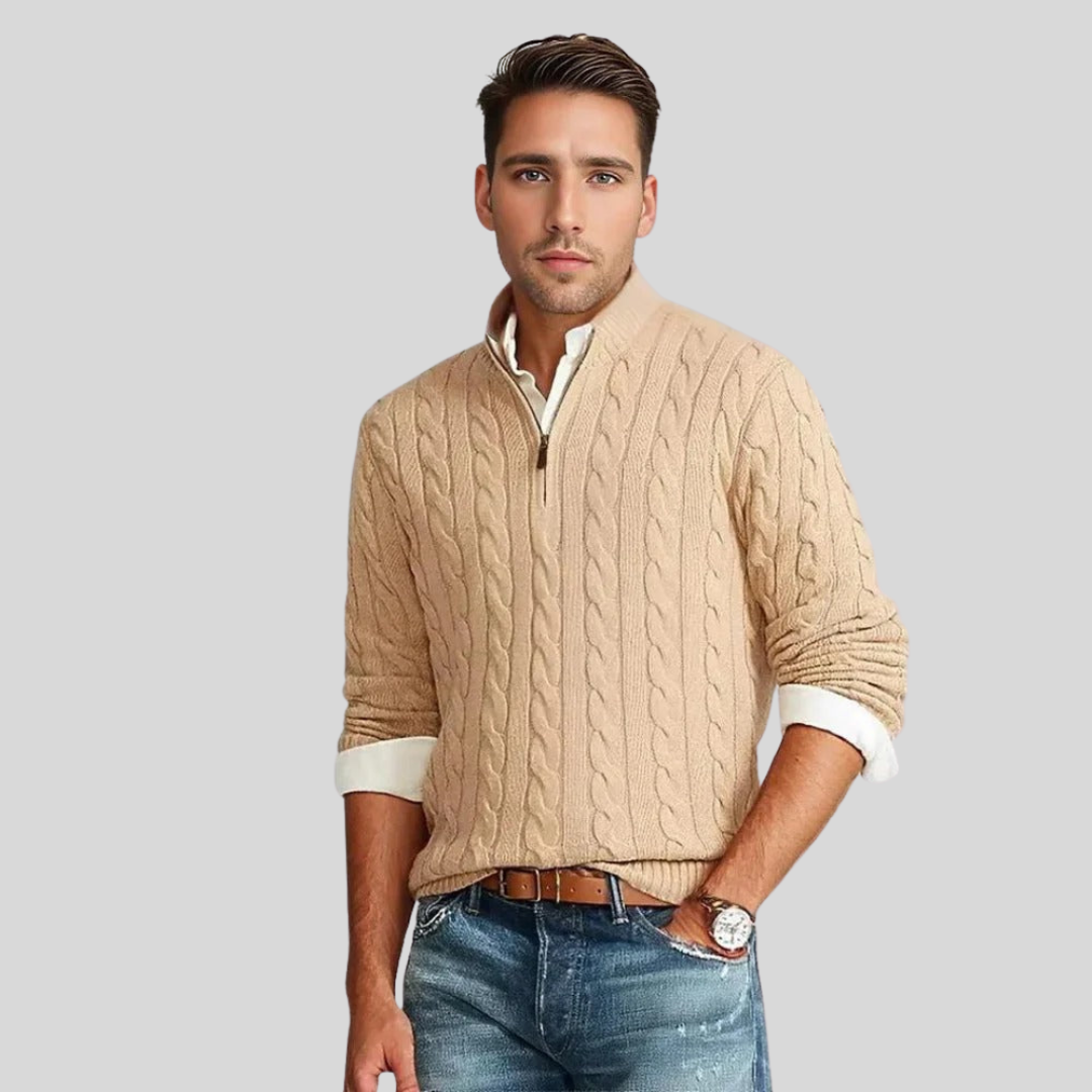 Close-up of a men's comfortable cable knit quarter-zip sweater, showcasing its intricate texture.