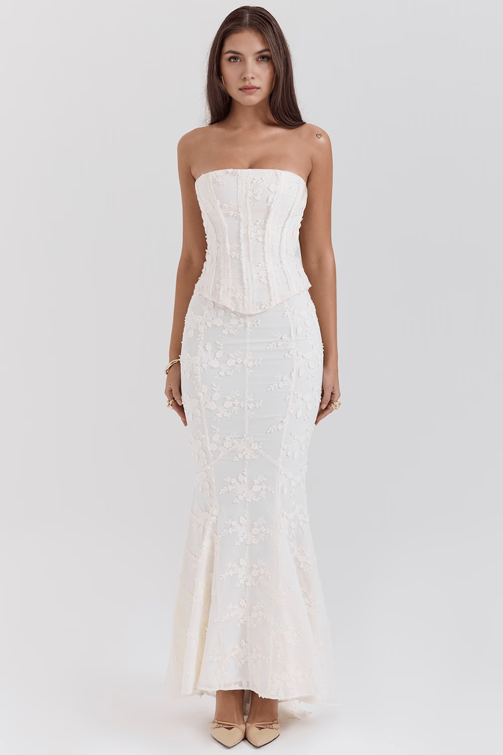 Sophisticated women's ivory bloom gown with delicate floral embroidery, perfect for elegant events.