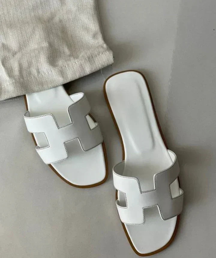 Elegant women's slip-on H-strap sandals with low heel, perfect for summer casual or dressy wear.