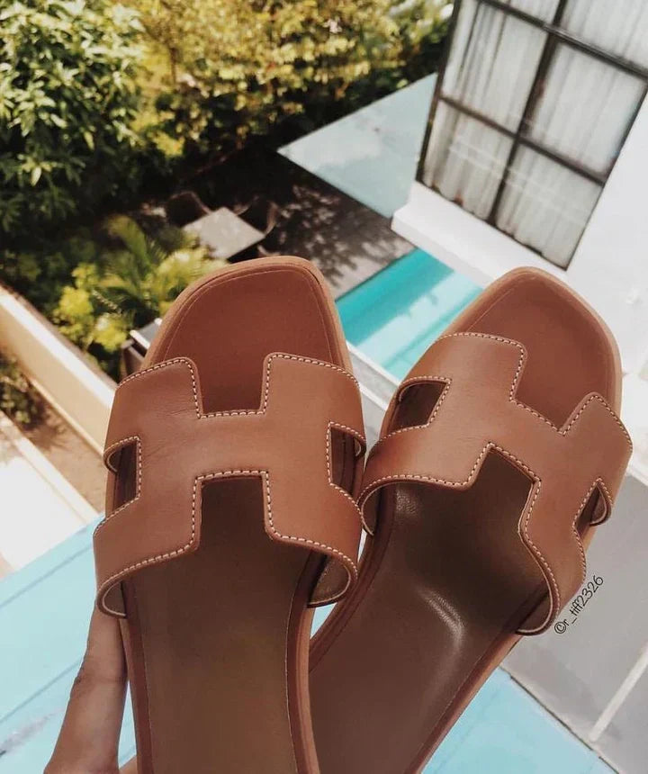 Women's comfortable slip-on sandals with elegant H-strap design, ideal low heel flat footwear for summer.