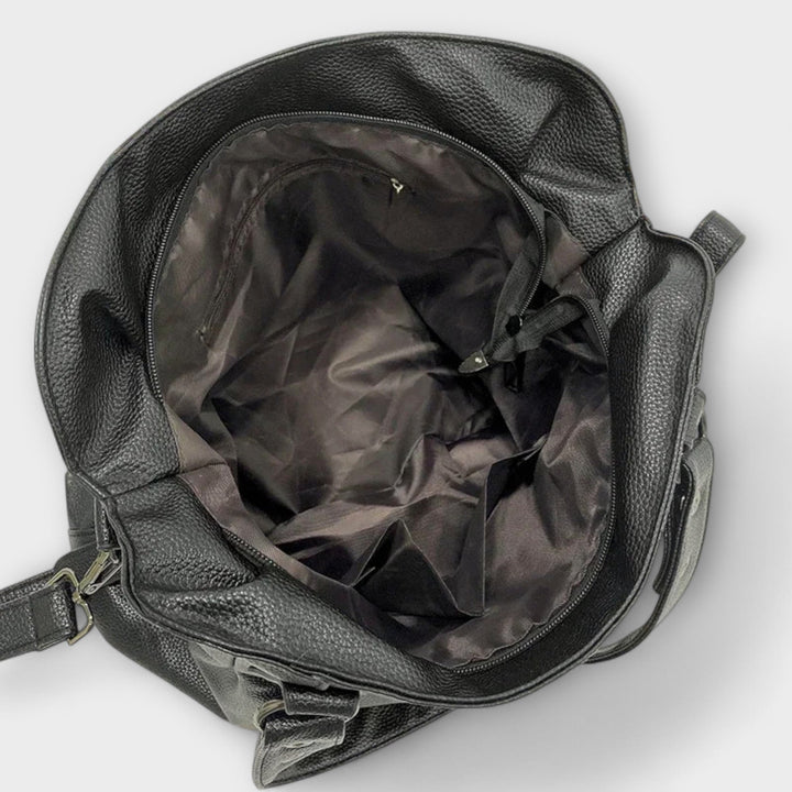 Sophisticated women's hobo bag, a stylish shoulder & crossbody option for various occasions.