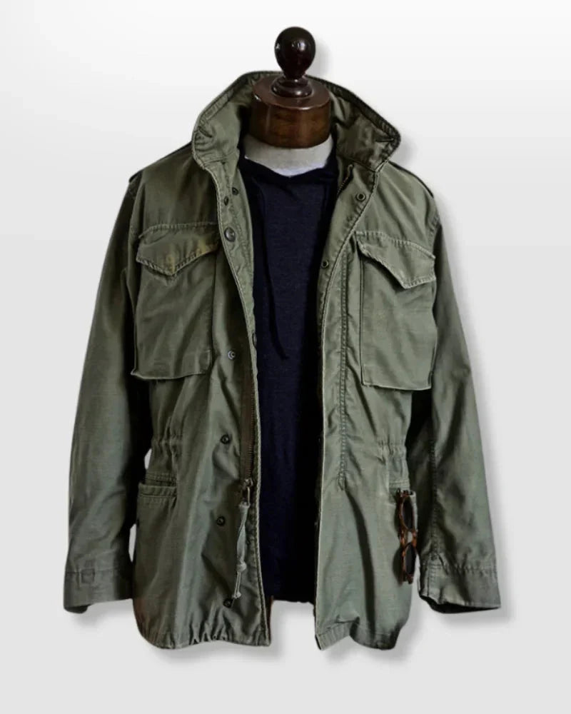 Green men's utility jacket with multi-pockets & adjustable cuffs; ideal long sleeve outerwear for adventure.